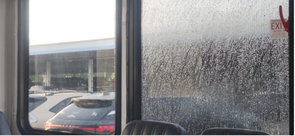 Traditional perforated window vinyl fogging on a bus. 