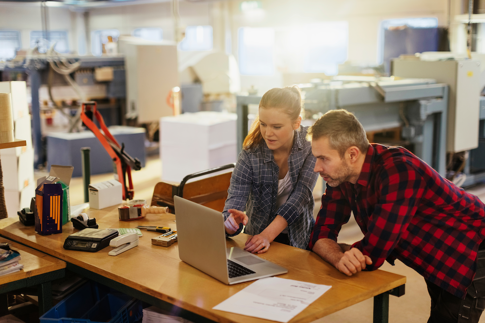 Design and production teams collaborating to improve print shop efficiency