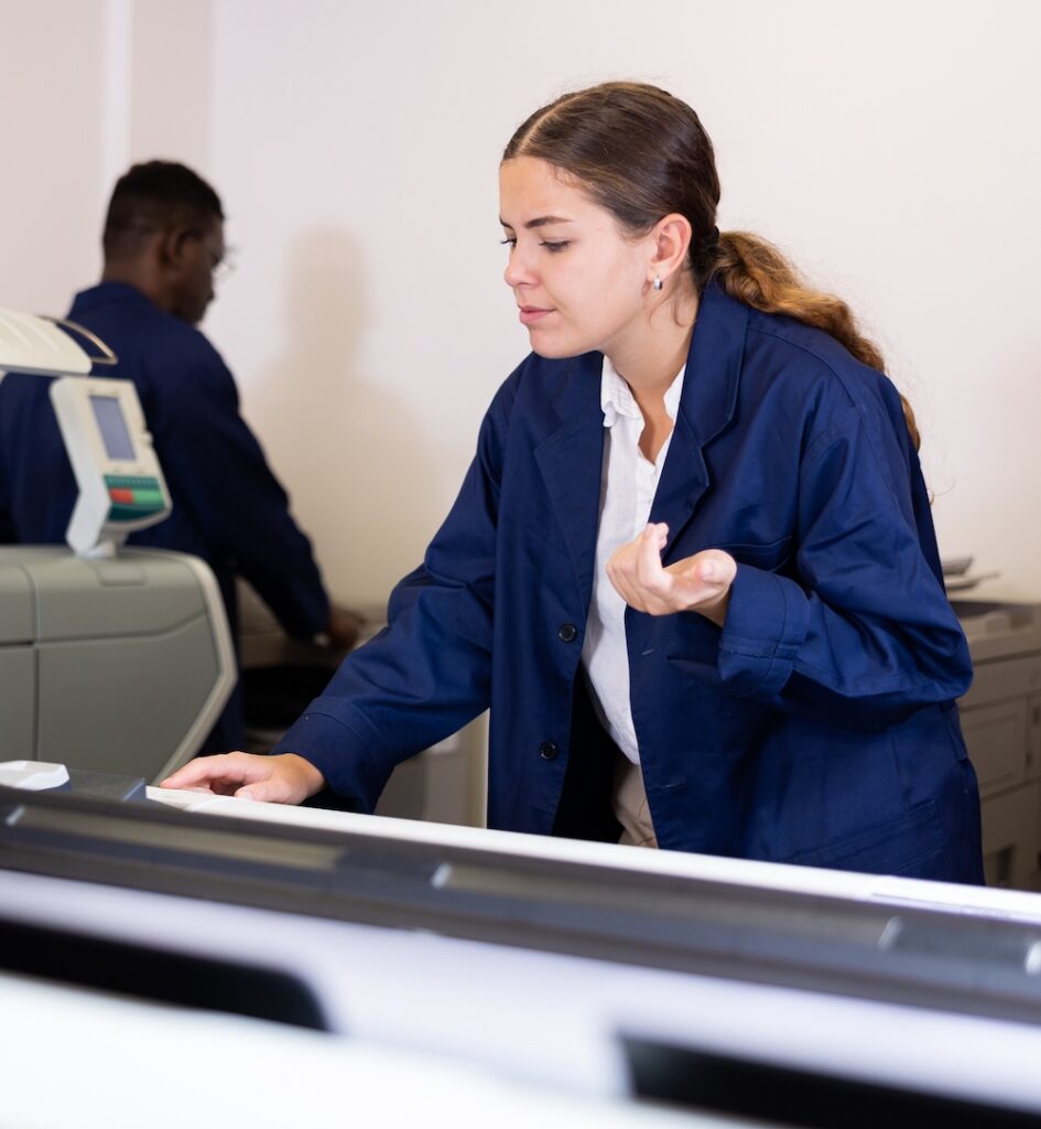 A woman frustrated using a traditional print workflow versus an integrated design-to-RIP workflow